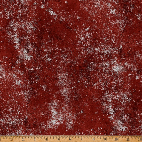 Textured red fabric with a ruler at the bottom for scale