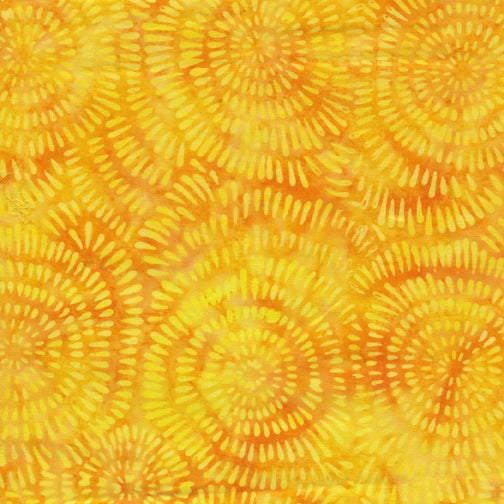 Patterned fabric with yellow and orange spiral design