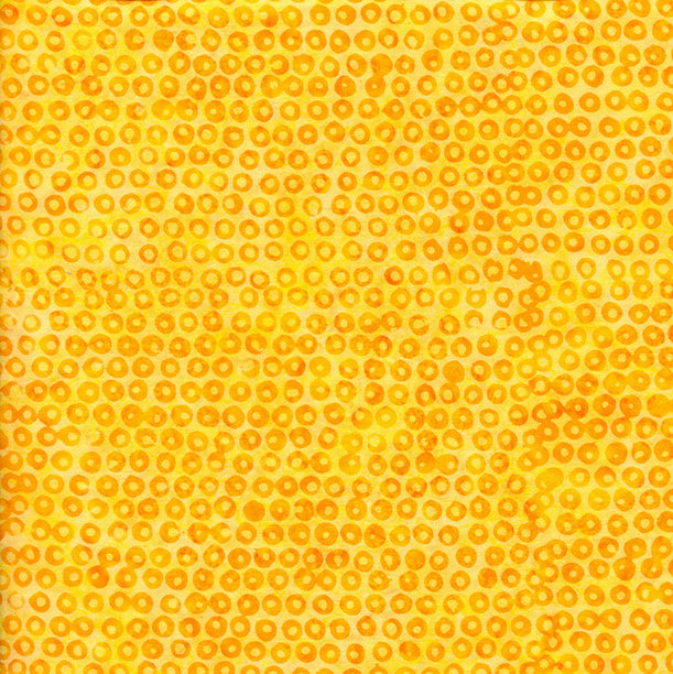 Yellow fabric with a subtle pattern of small circles