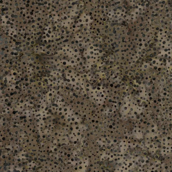A close-up of a textured material featuring a dense pattern of small black dots on a mottled beige and brown background.