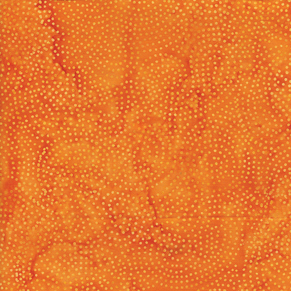 Orange fabric with a subtle pattern of small dots