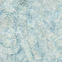 A close-up of a light blue and white abstract pattern with scattered circular dot motifs and soft marbled texture.
