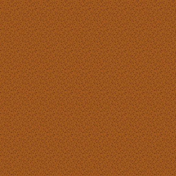 A close-up of a warm rust-orange fabric with a fine repeating dark brown leaf-like pattern.