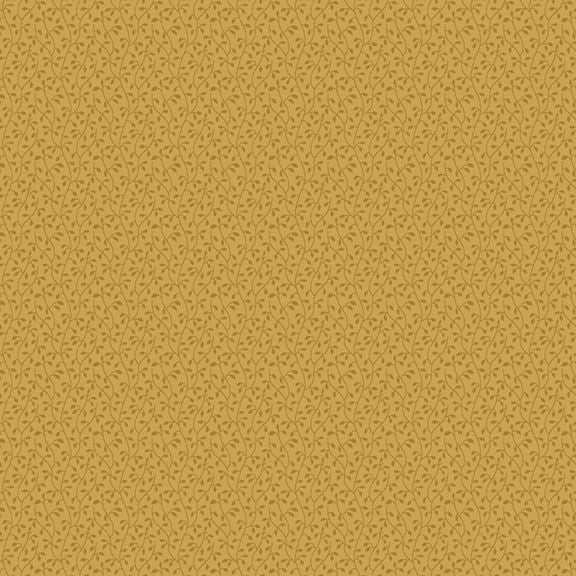 A close-up of a mustard yellow fabric pattern featuring a dense, repeating small-scale abstract leaf or vine motif in a slightly darker brownish tone.