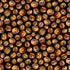 Pattern of variously carved Halloween pumpkins with glowing lights on a dark background.