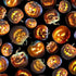Pattern of Halloween pumpkins with carved faces on a black background