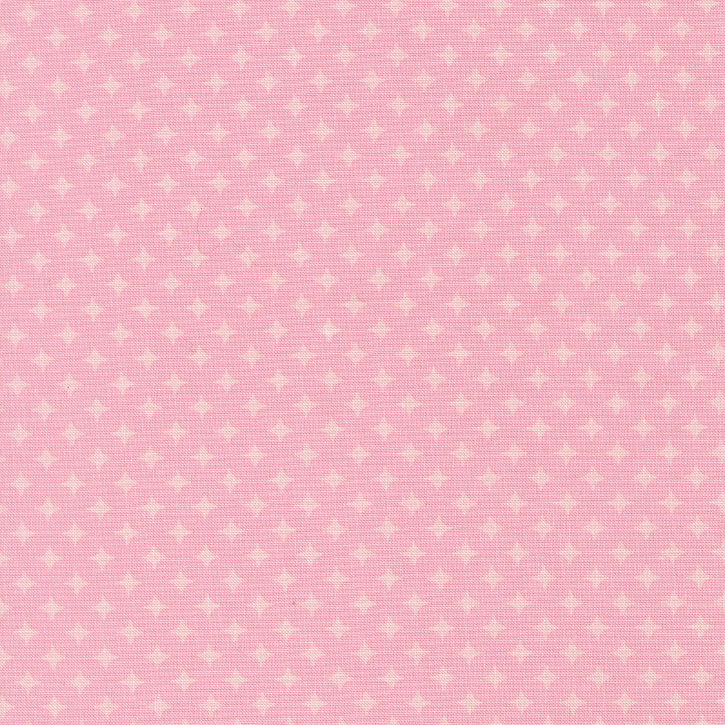 Pink fabric with small white star pattern