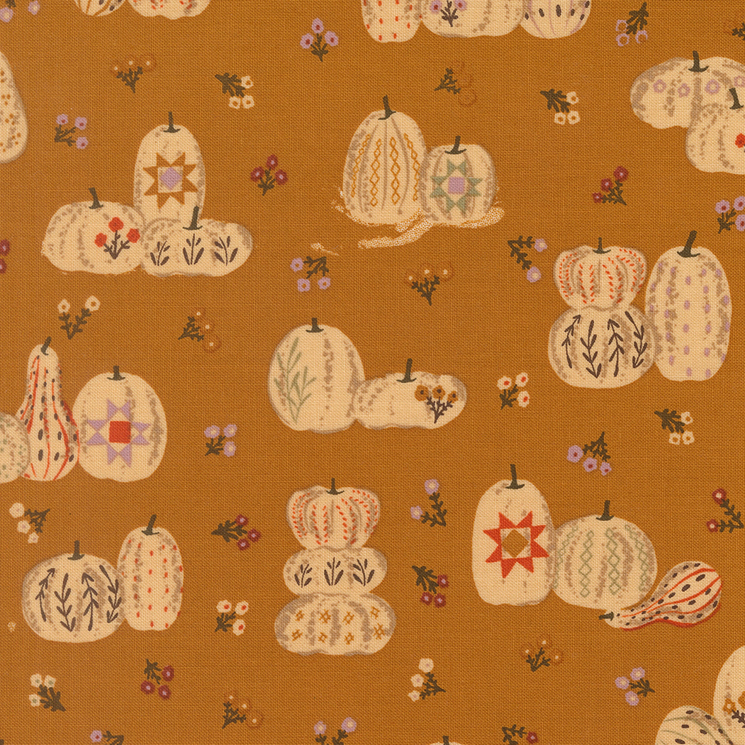 Pattern of decorative pumpkins and gourds on a brown fabric background