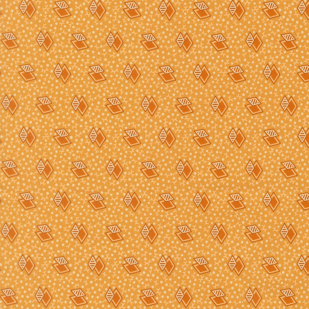 A repeating geometric pattern featuring orange-brown diamond and triangle motifs with white dotted details on a warm mustard-yellow background.