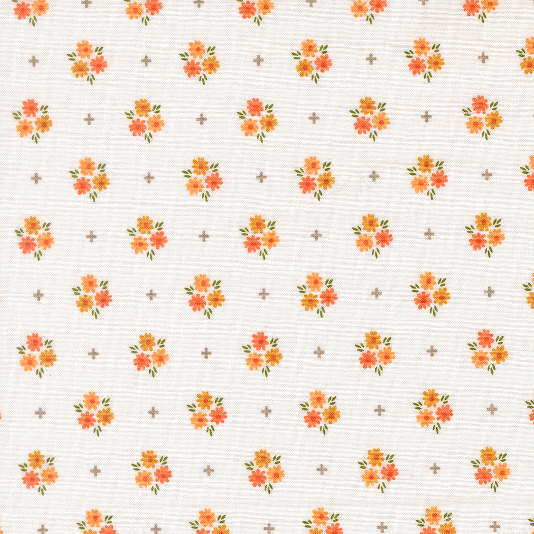 Pattern of small orange flowers on a white background