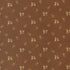 Brown fabric with a repeating pattern of small beige floral and leafy motifs.