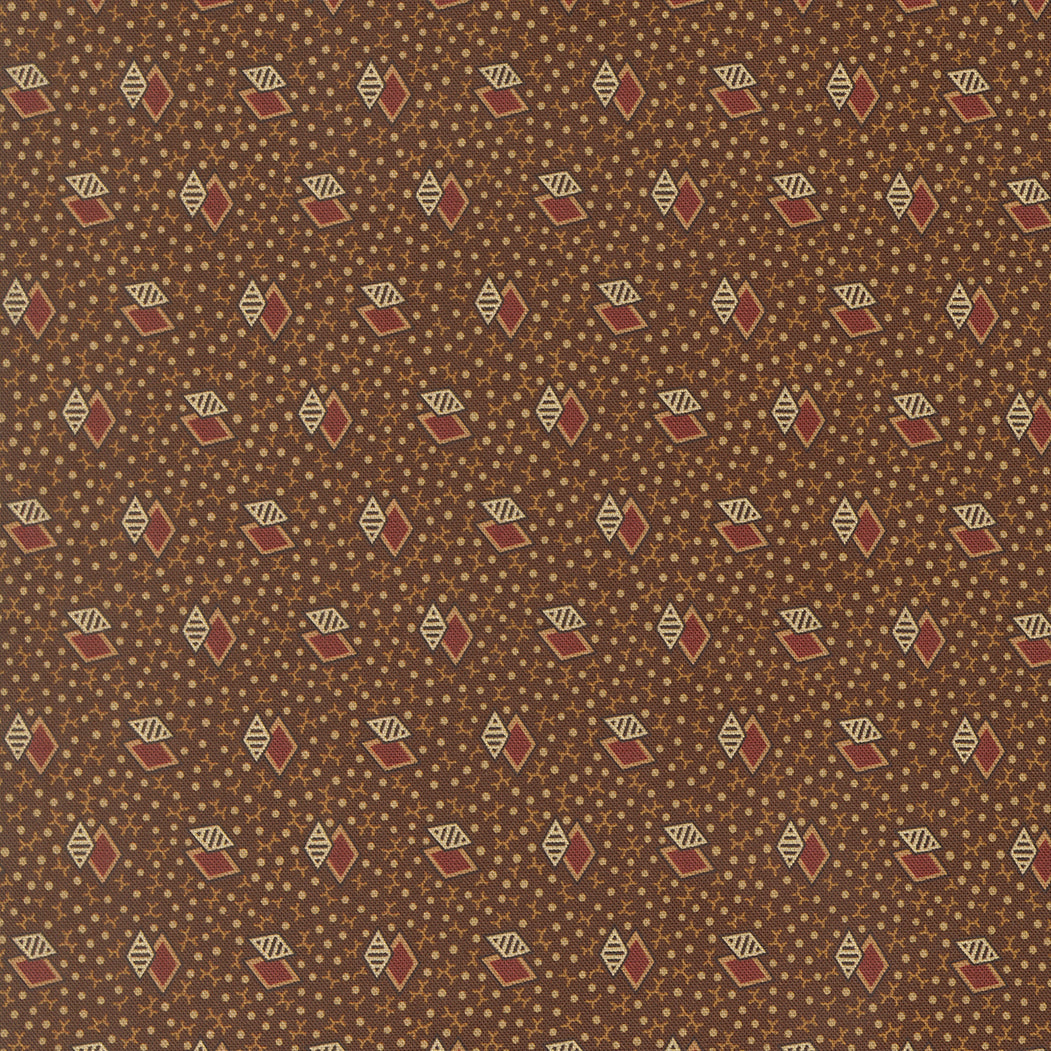 A close-up of a brown fabric or wallpaper pattern featuring a repeating geometric design of small diamonds, cream striped diamonds, and tiny gold dots.