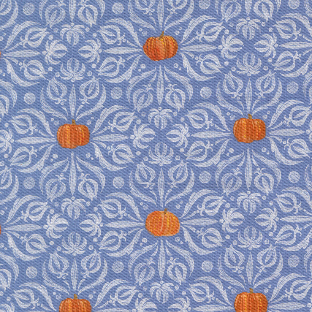 Patterned fabric with pumpkins on a blue background