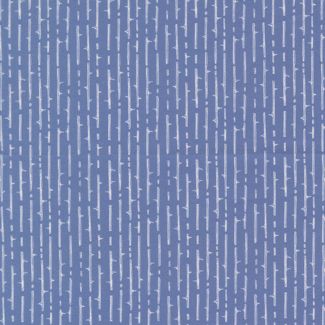 Blue pattern with white vertical lines on a blue background