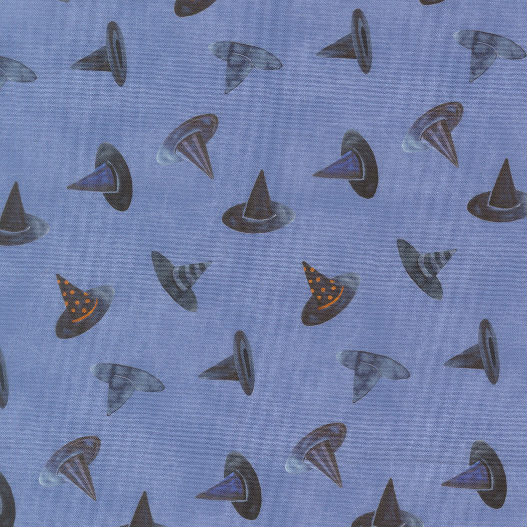Pattern of witch hats on a blue background