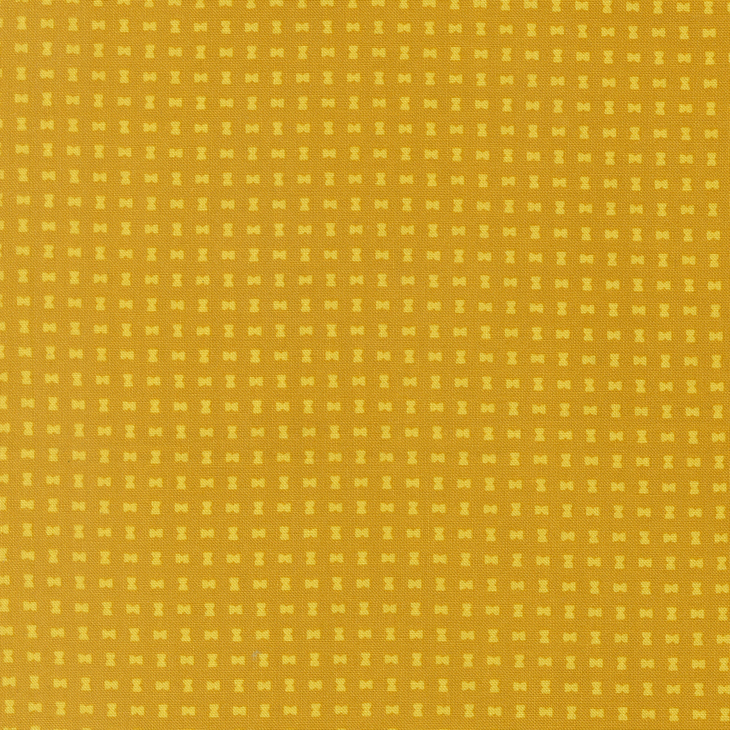 Pattern of small yellow squares on a yellow background