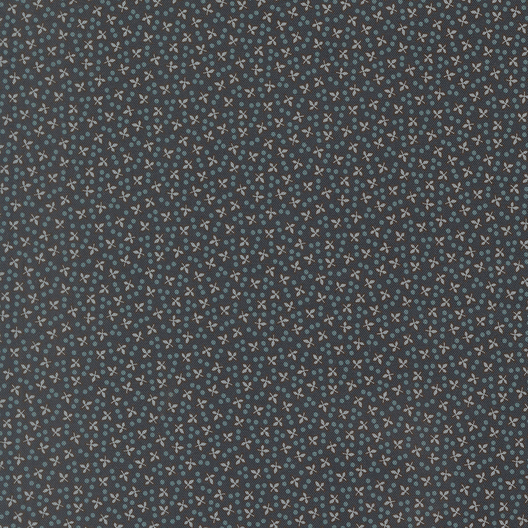 Patterned fabric with small cross and dot design on a dark blue background