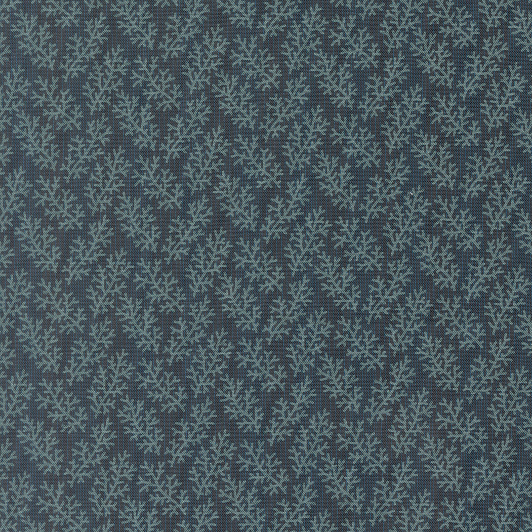 Patterned fabric with a blue and gray design on a dark background