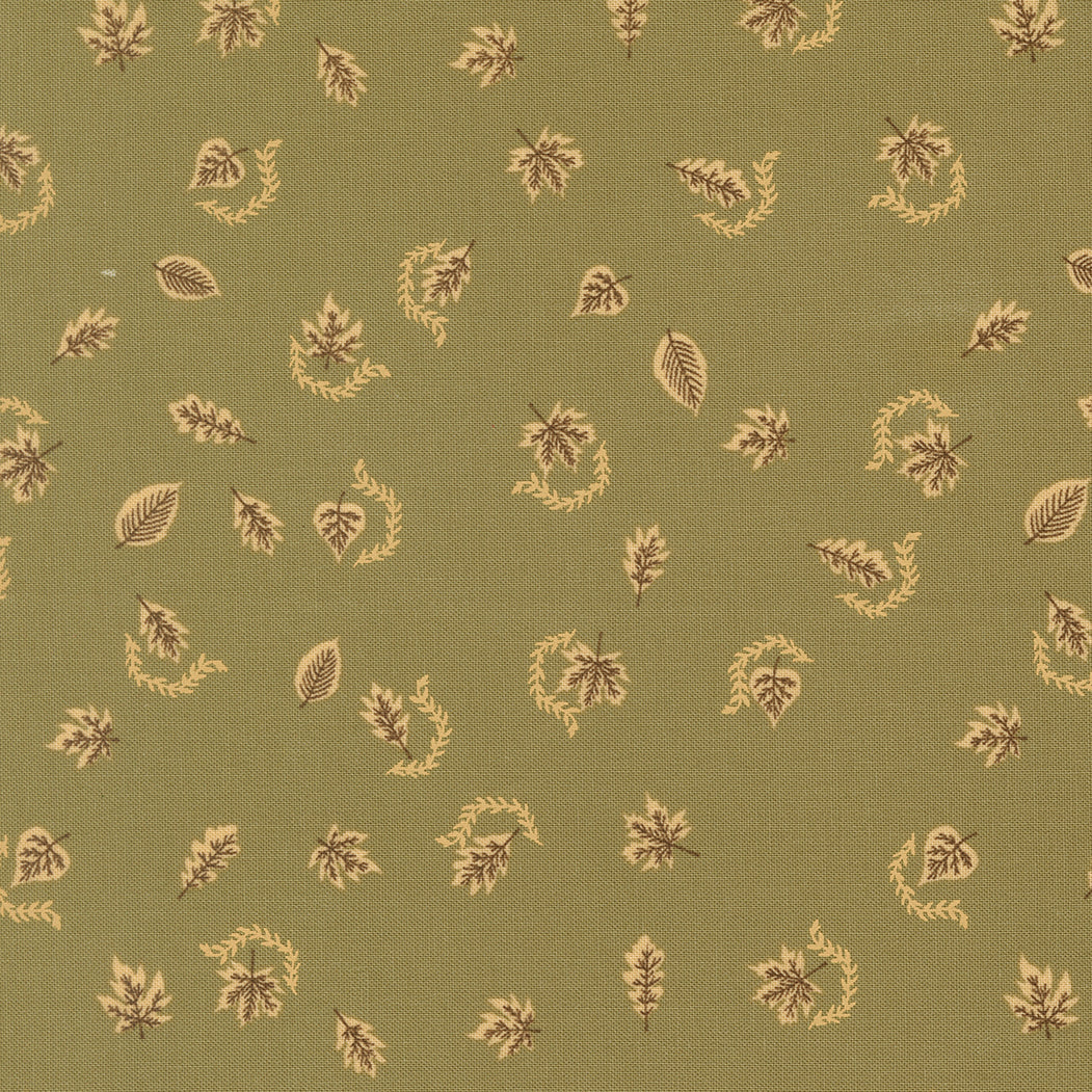 Pattern of leaves and branches on a green fabric background