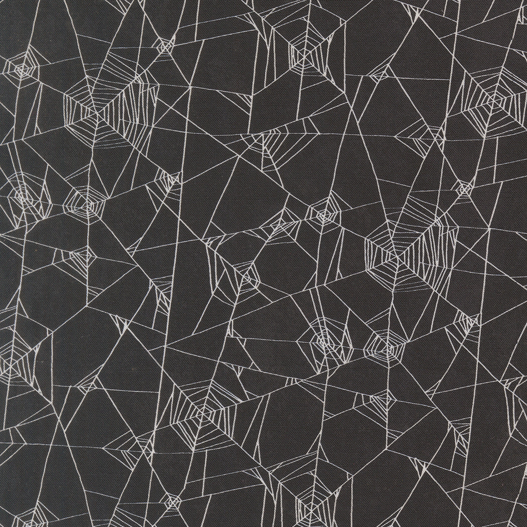Pattern of spider webs on a black background