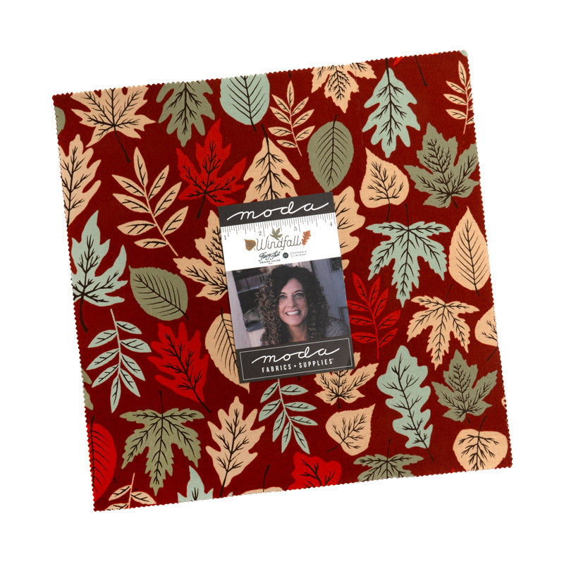 Fabric with autumn leaf pattern and Moda label on a white background
