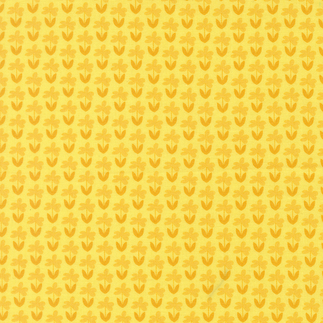 Yellow patterned background with small floral shapes