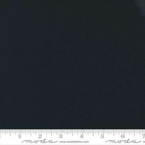 Solid black fabric swatch with a ruler at the bottom