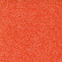 Patterned fabric with small white dots on a red-orange background