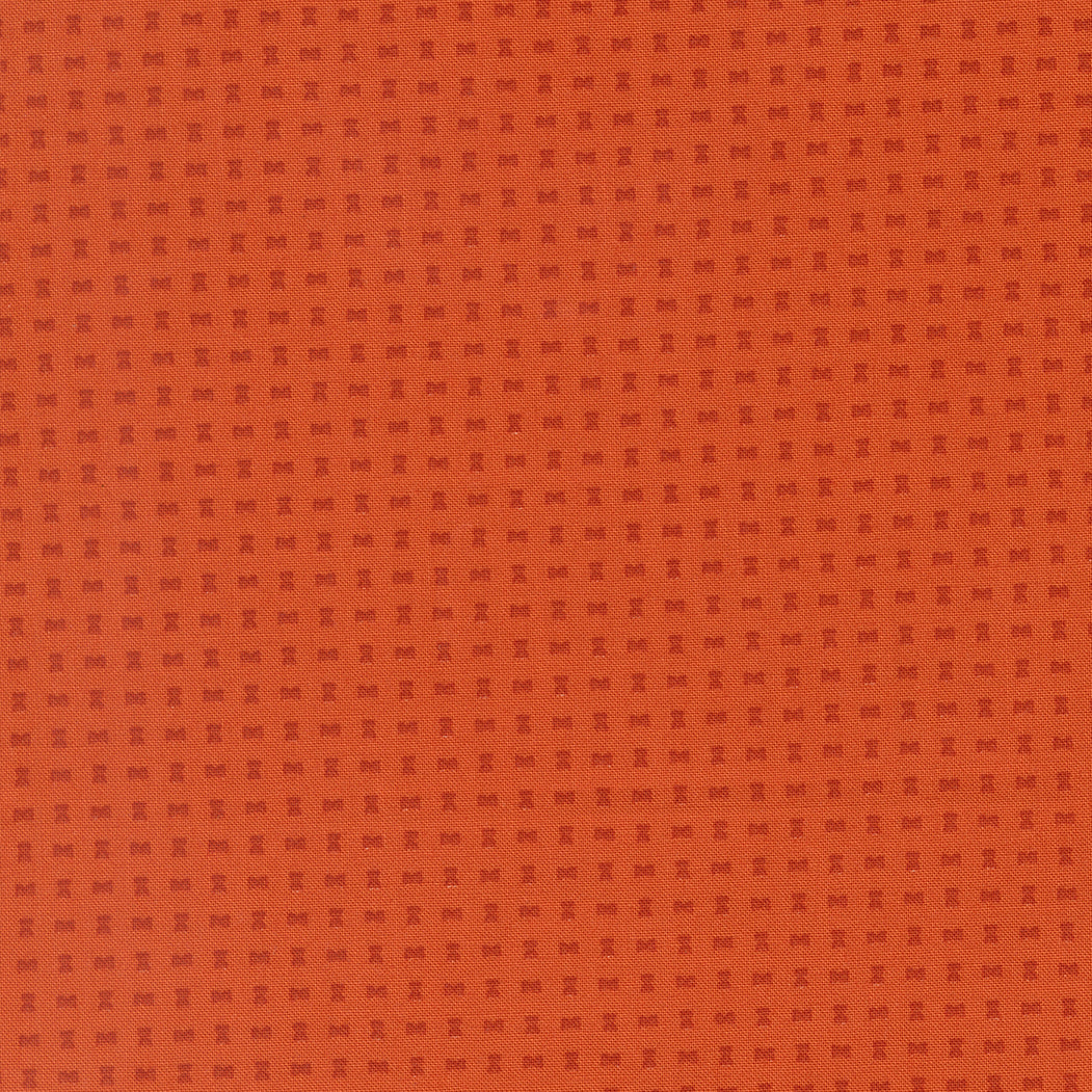Orange fabric texture with a subtle pattern