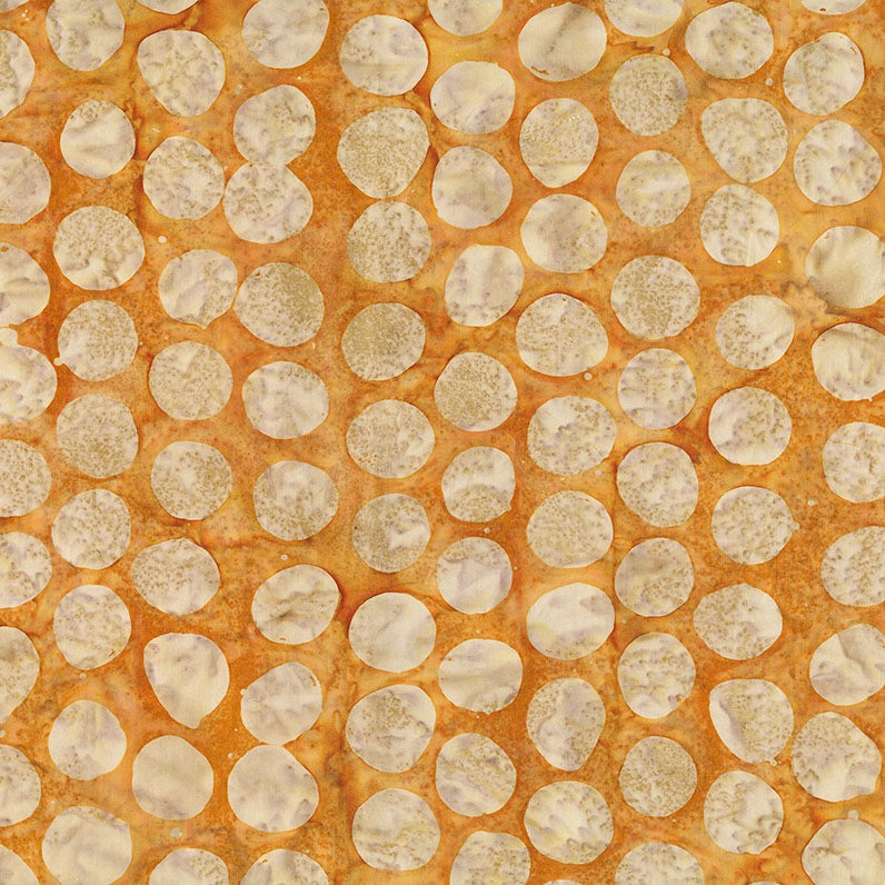 Pattern of circular beige shapes on an orange background