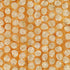 Pattern of circular beige shapes on an orange background