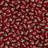 Christmas-themed fabric pattern with holly leaves and berries on a red background