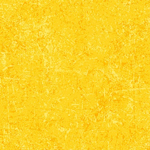 A close-up of a textured yellow surface with subtle lighter and darker yellow mottling, filling the entire frame.