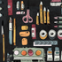 A flat-lay illustration of various stationery items on a dark textured background, including yellow pencils, pink scissors, a blue pen, orange erasers, and paint tubes.