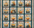 A repeating autumn-themed fabric featuring illustrated pumpkins and gourds arranged in a grid, with a decorative border around the edges. The motifs use orange, beige, gray, and dark teal tones.