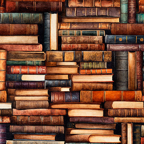 Stacks of vintage books in various colors arranged in a pattern.