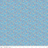 Floral pattern fabric on a blue background with a ruler at the bottom.