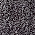 A close-up of a repeating botanical pattern featuring delicate white leafy vines and small oval leaves on a solid black background.