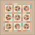 Quilt with colorful geometric pattern on a beige background