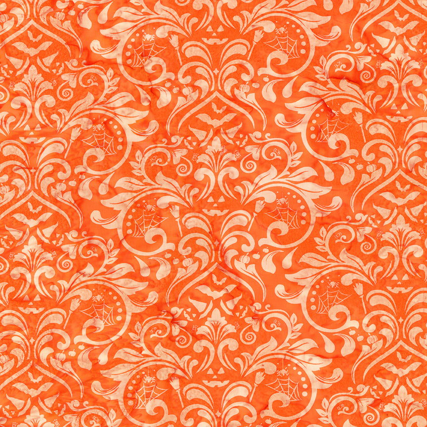 Decorative pattern with white swirls and floral elements on an orange background