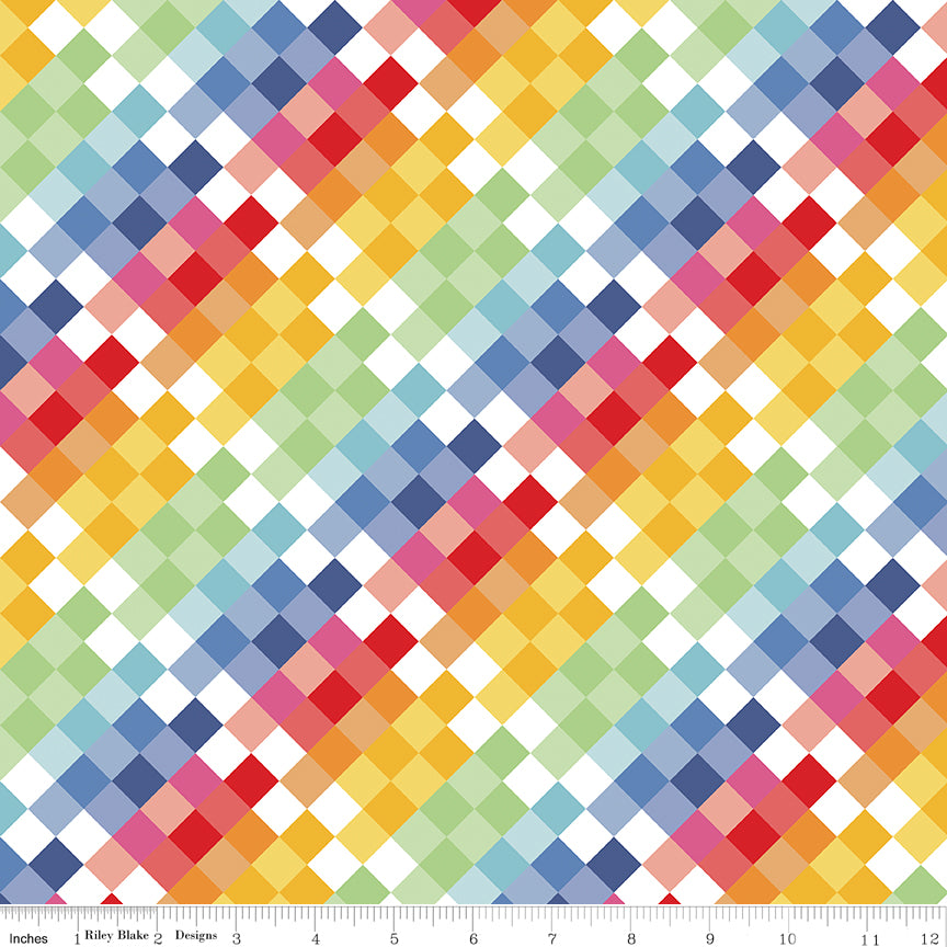 Colorful diamond pattern fabric with a ruler at the bottom