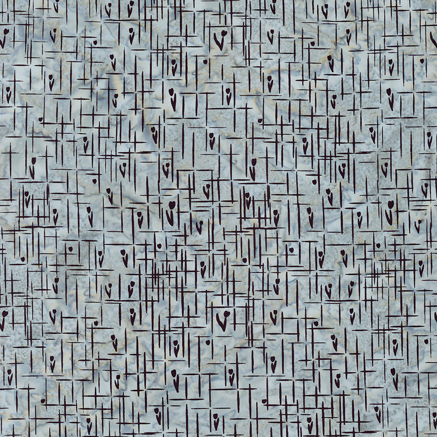 A close-up of a woven textile pattern with a light gray base and dark brown intersecting lines and small heart-like motifs.