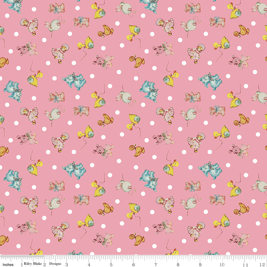 Fabric with cartoon characters on a pink polka dot background