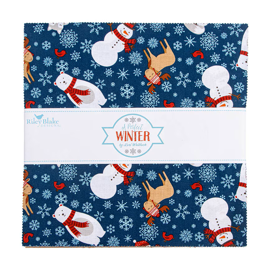 A folded fabric bundle with a navy blue winter print featuring snowmen, reindeer, snowflakes, and red accents, wrapped in a white paper band labeled Riley Blake Fabrics 'A Perfect WINTER'.