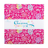 A folded fabric bundle from Riley Blake Designs featuring a bright pink background with a colorful floral and swirl pattern, wrapped in a white paper band labeled 'Chasing Rainbows'.