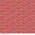 Floral patterned fabric on a red background with a ruler at the bottom.