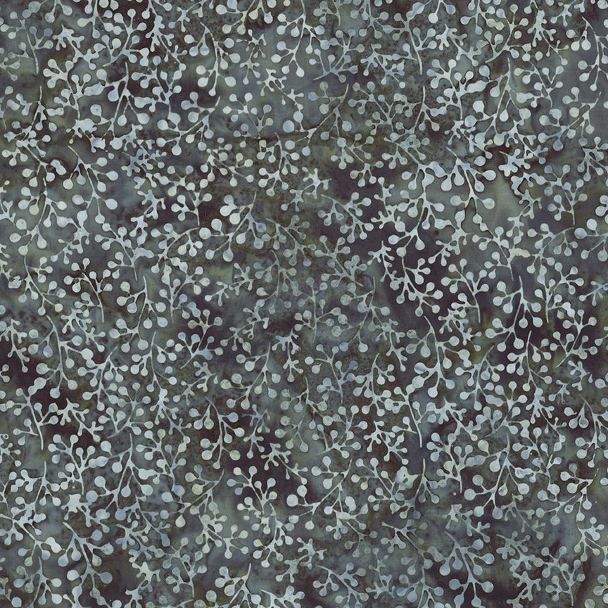 A close-up of a fabric or wallpaper pattern featuring delicate, branching leafy vines in a muted sage green and gray color palette over a dark, textured background.