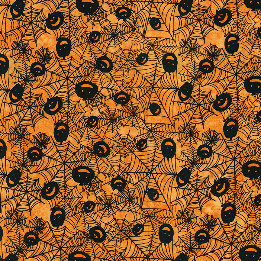 Halloween-themed fabric pattern with pumpkins and spider webs on an orange background