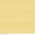 Patterned fabric with white dots on a yellow background