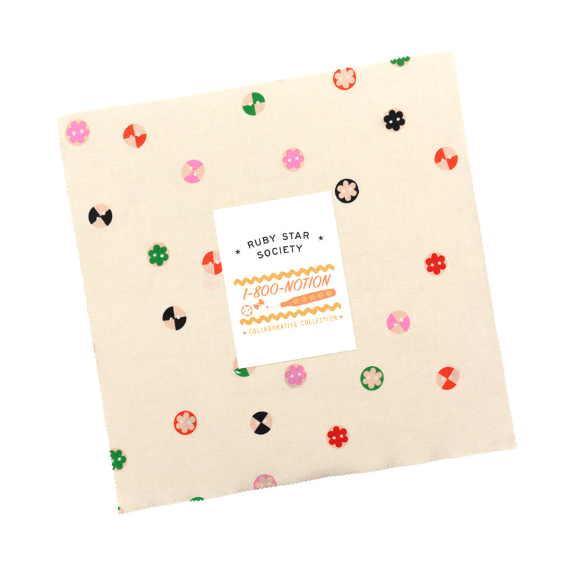 Fabric with colorful patterns and a Ruby Star Society label on a white background